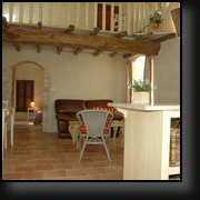 Kitchen and living room with ancient beams and posts