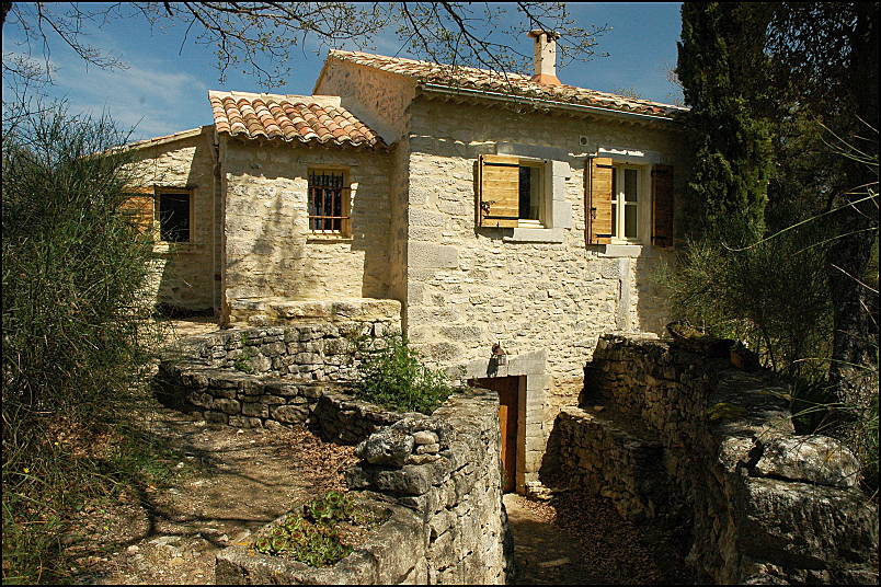 Several century old stone building in the hills of Luberon